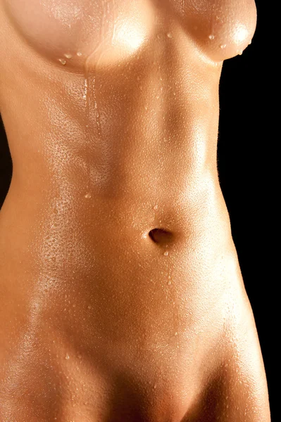 stock image Wet abdomen of a nude young woman