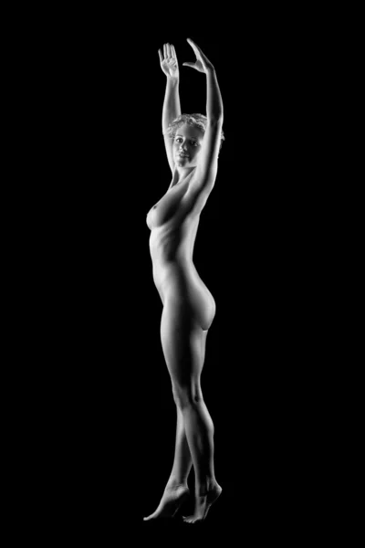 stock image Young naked women on black background