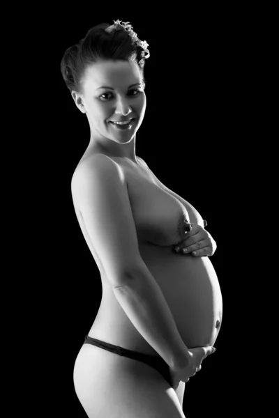 stock image Beautiful pregnant woman in back