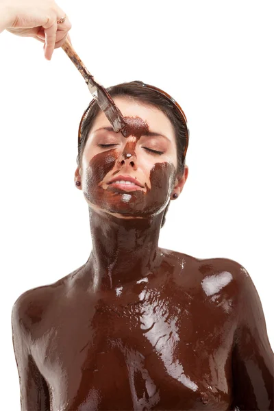 stock image Young woman having a chocolate face mask