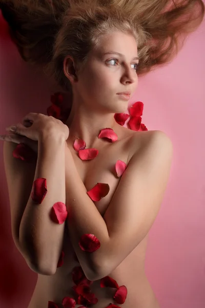 stock image Beautiful girl in rose petal