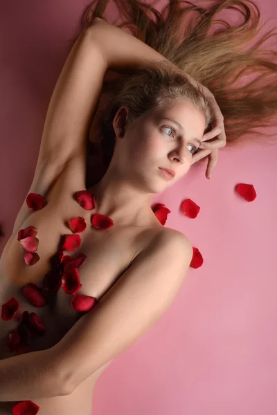 stock image Beautiful girl in rose petal